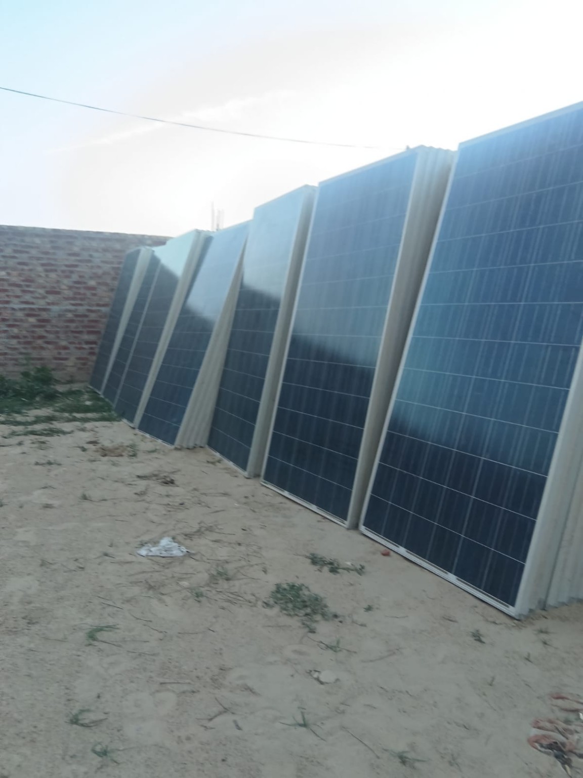 Damaged solar panels ready for scrap